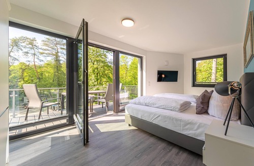 Krakow am See アパートメント | Modern 5-star vacation apartment "Fledermaus" with roof terrace on Lake Krakow