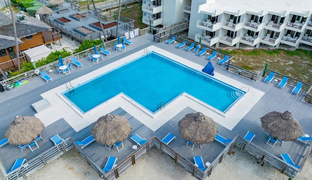 Barefoot Bliss: Ground Floor Condo with Den & Dual Balconies