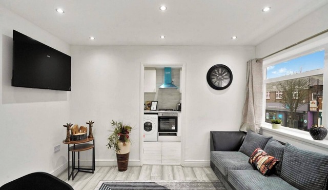 Comfortable Four-Bedroom Stay with Balcony