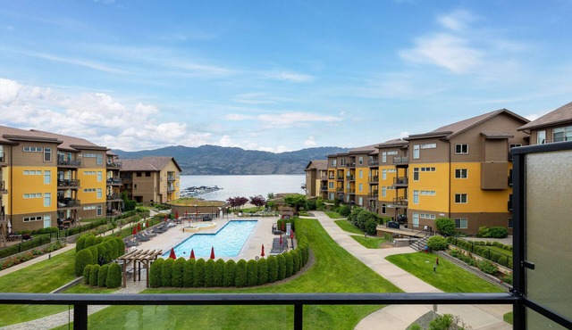 Okanagan Lake Beachfront Penthouse. 2 Bedrooms + den, 3 bath. Boatslip Option.